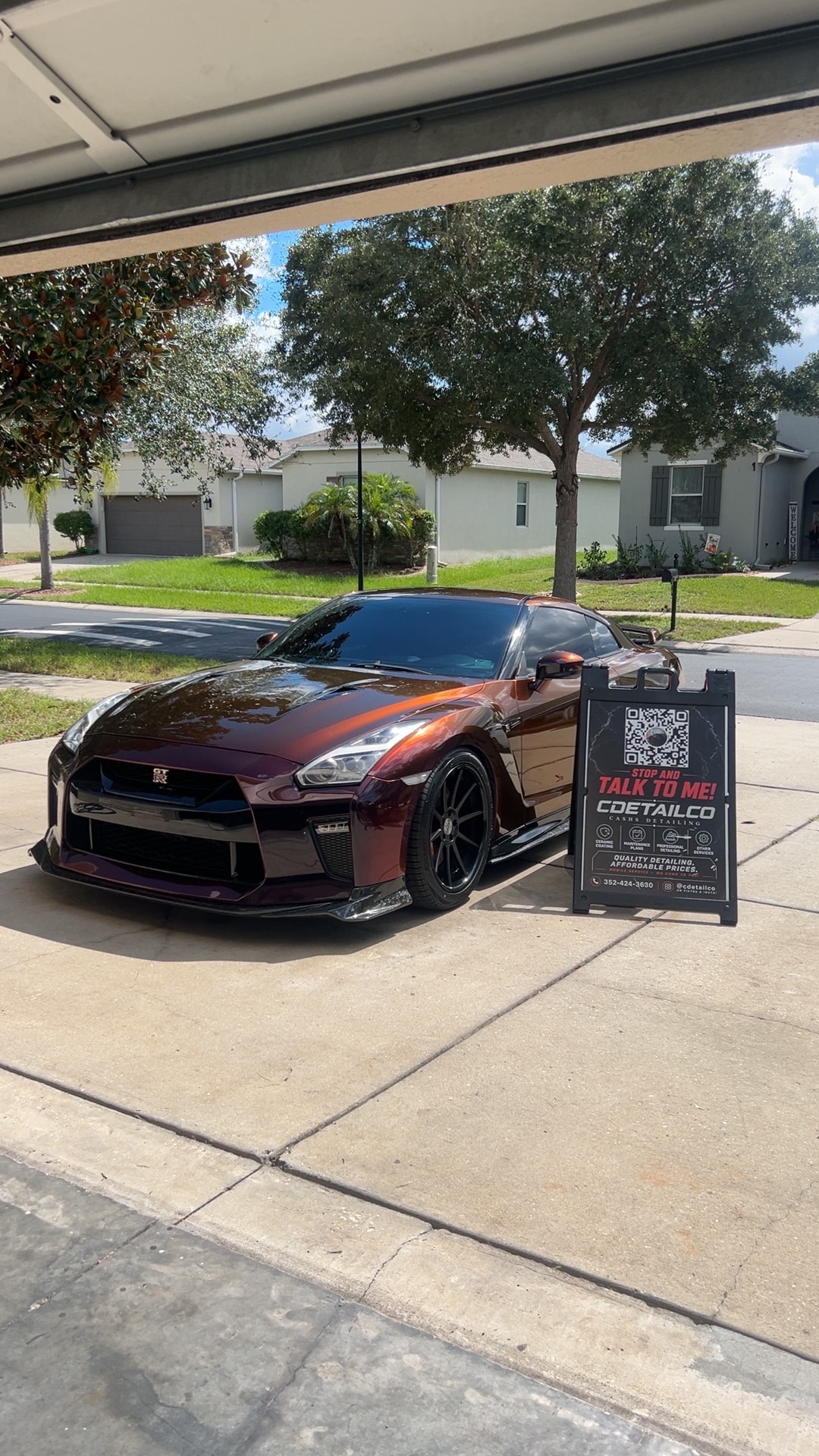 Nissan GT-R with a deep metallic purple-to-copper finish after a glossy exterior detail