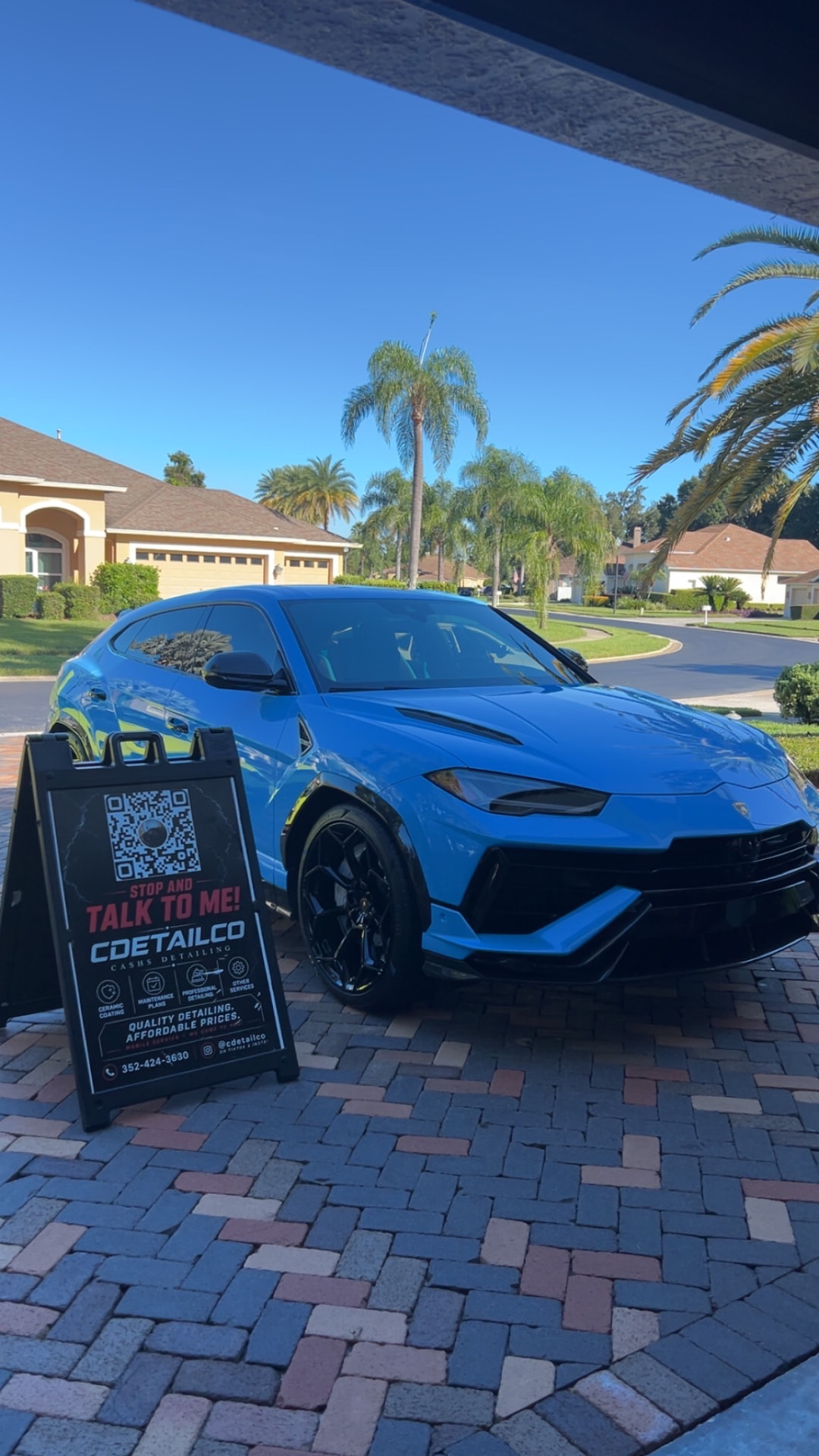 Blue Lamborghini Urus SUV with high-gloss paint and deep black trim
