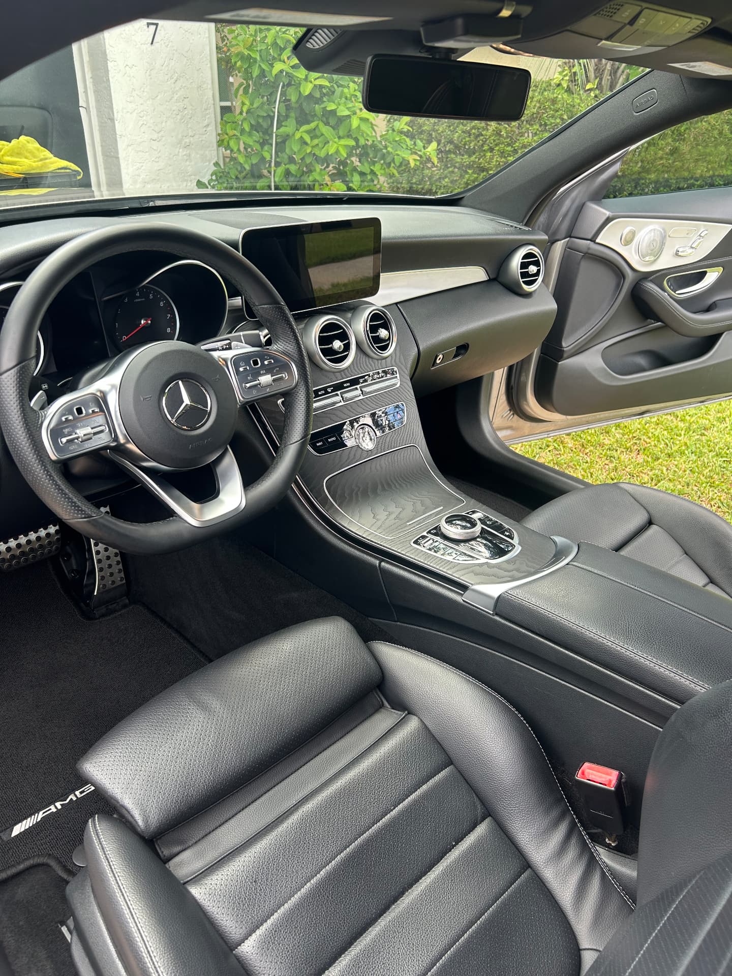 Mercedes-AMG interior with cleaned black leather seats and conditioned steering wheel